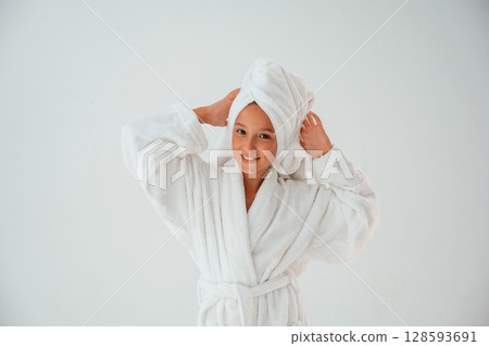 With towel on the head. Conception of beauty and self care. Young girl is in the studio With towel on the head. Conception of beauty and self care. Young girl is in the studio 128593691