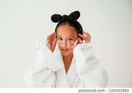 Cheerful, with eye patches. Conception of beauty and self care. Young girl is in the studio Cheerful, with eye patches. Conception of beauty and self care. Young girl is in the studio 128593869