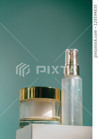 Glass cream jar and facial spray bottle Glass cream jar and facial spray bottle 128594835
