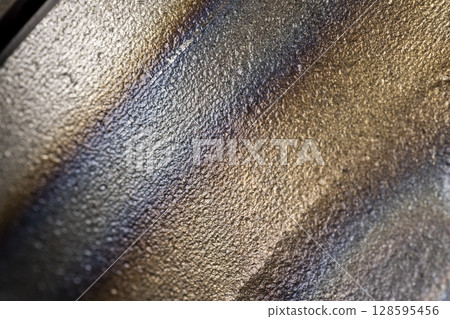 a metal part for repairing a car brake system, a part of an automobile part for fixing car wheels and repairing the chassis, wheel hub car, closeup 128595456
