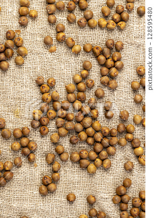 fried but not boiled chickpeas are on the table with a tablecloth fried but not boiled chickpeas are on the table with a tablecloth 128595480