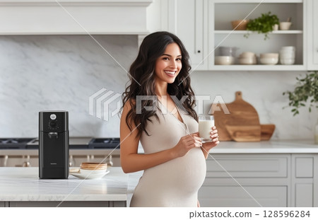 Pregnant Woman Enjoying a Glass of Milk in a Modern Kitchen With Stylish Decor and Appliances 128596284
