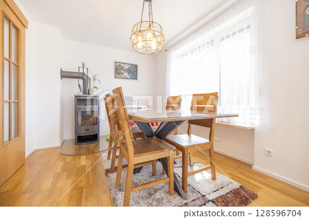 Modern dining room with elegant furniture, ideal for real estate and interior design 128596704