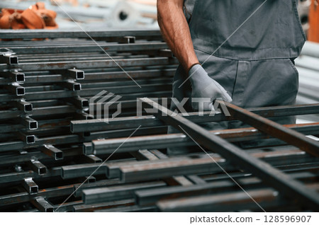 Close up view of man that is working at the factory 128596907