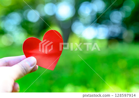 Hands holding a heart in outdoor nature Love Encounter Background material Background Morning color Hands holding a heart in outdoor nature Love Encounter Background material Background Morning color 128597914
