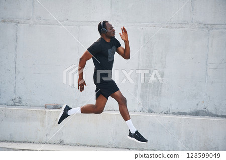 Sportive black man is running, morning routine 128599049