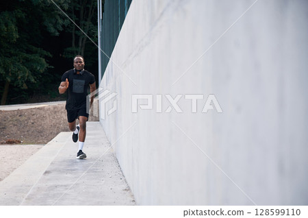 Sportive black man is running, morning routine 128599110
