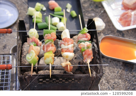 Lake Biwa, Shiga Prefecture: Camping in the green space along the lake shore and Mt. Hiei and the Hira mountain range Lake Biwa, Shiga Prefecture: Camping in the green space along the lake shore and Mt. Hiei and the Hira mountain range 128599208