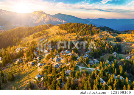 Mountain village in Alps, wooden houses, Velika Planina, Kamnik, Slovenia Mountain village in Alps, wooden houses, Velika Planina, Kamnik, Slovenia 128599369