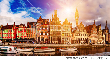 Ghent city historical center, tourists boats and colorful buildings on Leie river bank, Belgium 128599507
