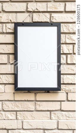 Blank White Frame on Beige Brick Wall Blank White Frame on Beige Brick Wall 128600175