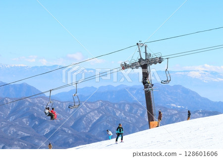 Hakuba Happo-one Ski Resort Mountain scenery and skiers on the lift Hakuba Happo-one Ski Resort Mountain scenery and skiers on the lift 128601606