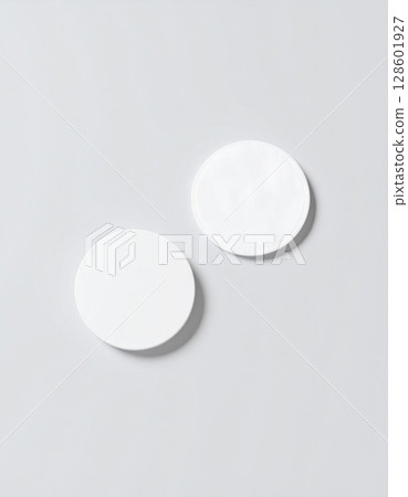 Two White Blank Circles on a Light Grey Background 128601927