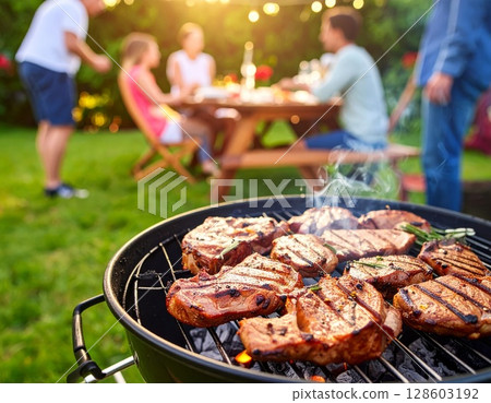 Juicy barbecue meat on the grill, close view, summer barbecue bliss background 128603192