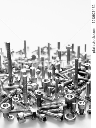 Assembly of bolts and nuts (machine parts image / vertical composition) 128603481