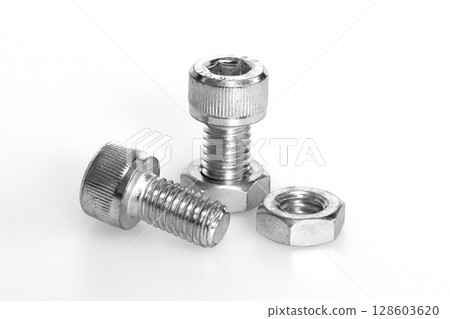 Bolts and nuts (machine parts image) 128603620