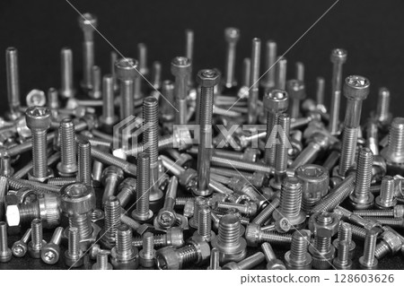 Assembly of bolts and nuts (image of machine parts) Assembly of bolts and nuts (image of machine parts) 128603626