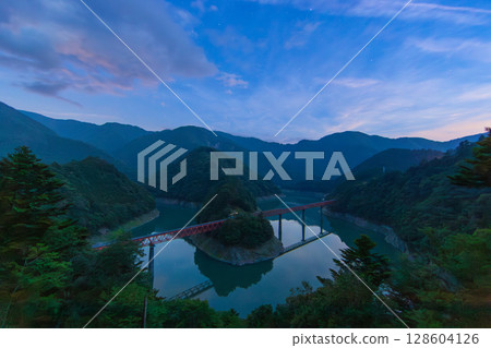 Unexplored station floating on the blue lake surface 128604126