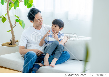 Dad playing with boy Dad playing with boy 128604813
