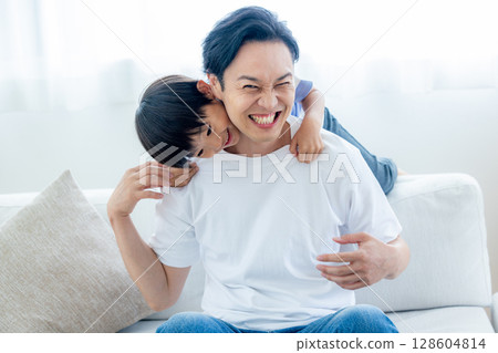 Dad playing with boy Dad playing with boy 128604814