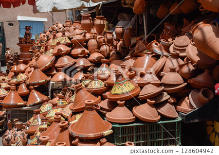 A set of tagines of many types displayed in street stalls in the souk for sale. 128604942