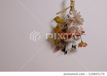 Create a Halloween image with artificial flower swags Create a Halloween image with artificial flower swags 128605179