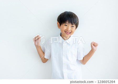 Portrait of an elementary school student on a white background 128605264
