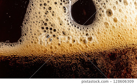 AI image: Dark beer poured into a chilled glass 128606309