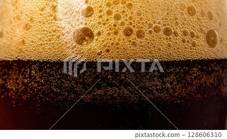 AI image: Dark beer poured into a chilled glass 128606310