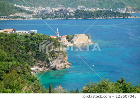 panoramic of Mogren beach in Budva riviera, coast of Montenegro panoramic of Mogren beach in Budva riviera, coast of Montenegro 128607043