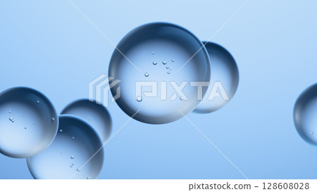 Clean blue background with transparent spheres. Conceptual image for beauty. 128608028