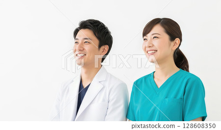 Asian doctor and nurse standing smiling on white background 128608350