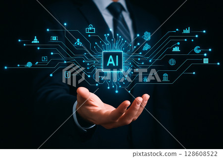 AI generated futuristic image of a businessman holding a glowing AI chip hologram with connected icons representing data business finance industry and technology in a seamless digital interface 128608522