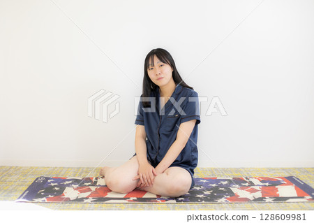 Yoga mat and young woman Yoga mat and young woman 128609981