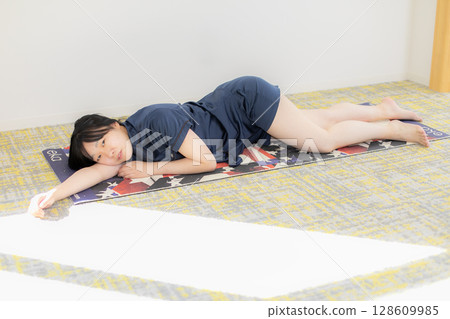 Yoga mat and young woman 128609985