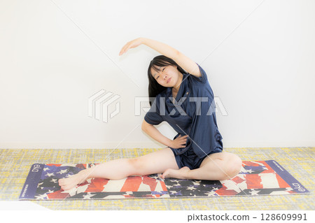 Yoga mat and young woman Yoga mat and young woman 128609991