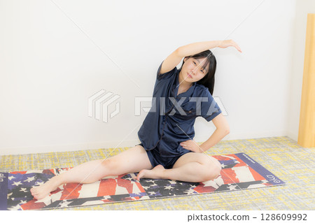 Yoga mat and young woman 128609992
