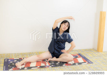 Yoga mat and young woman Yoga mat and young woman 128609993