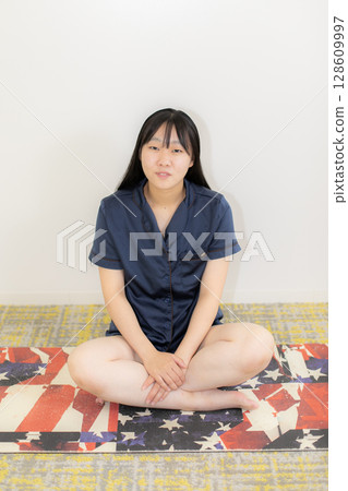 Yoga mat and young woman 128609997