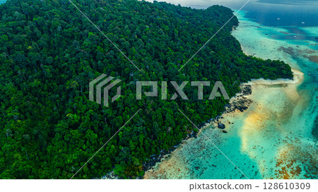 Aerial view of The coastline around the island is full of coral reefs. 128610309