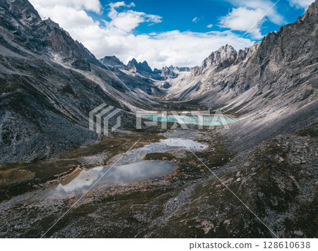 Aerial view of beautiful lake in high altitude mountains landscape Aerial view of beautiful lake in high altitude mountains landscape 128610638