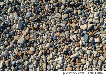 Smooth Beach Stones A Natural Mosaic of Textures and Colors on the Shoreline Smooth Beach Stones A Natural Mosaic of Textures and Colors on the Shoreline 128611087