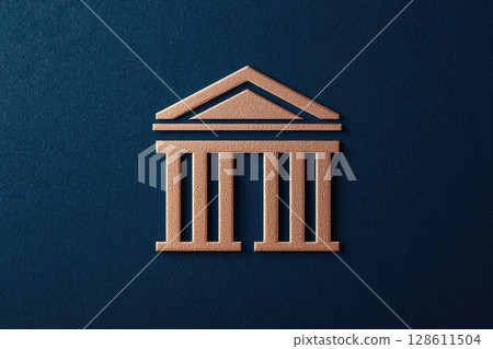 A gold colored building with columns 128611504