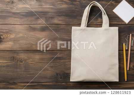 Simple Tote Bag Mockup on Wooden Surface Simple Tote Bag Mockup on Wooden Surface 128611923