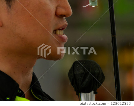 Election street speech in the rain 128612533