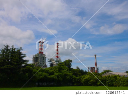 Blue sky and factory chimney Blue sky and factory chimney 128612541