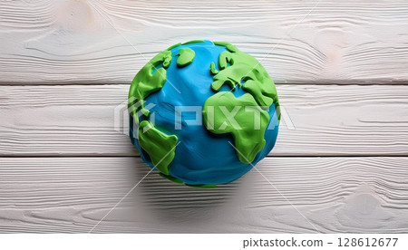 Handmade Plasticine Planet Earth Model on White Wooden Background for Eco Education 128612677