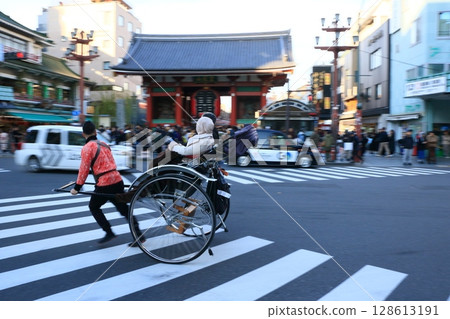 Rickshaws racing through Asakusa 128613191