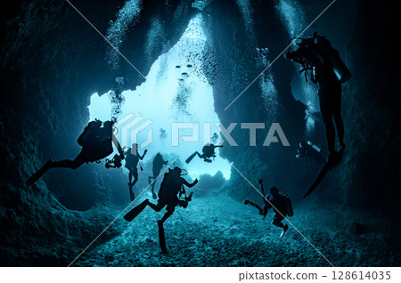 Group of Scuba divers in Koh Haa Yai, a large underwater cavern in Thailand 128614035