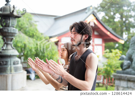 Inbound tourists praying at a shrine Inbound tourists praying at a shrine 128614424